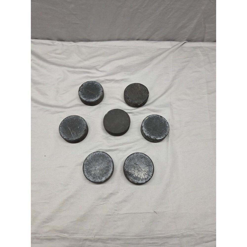 Set Of 7 Practice Hockey Pucks Used